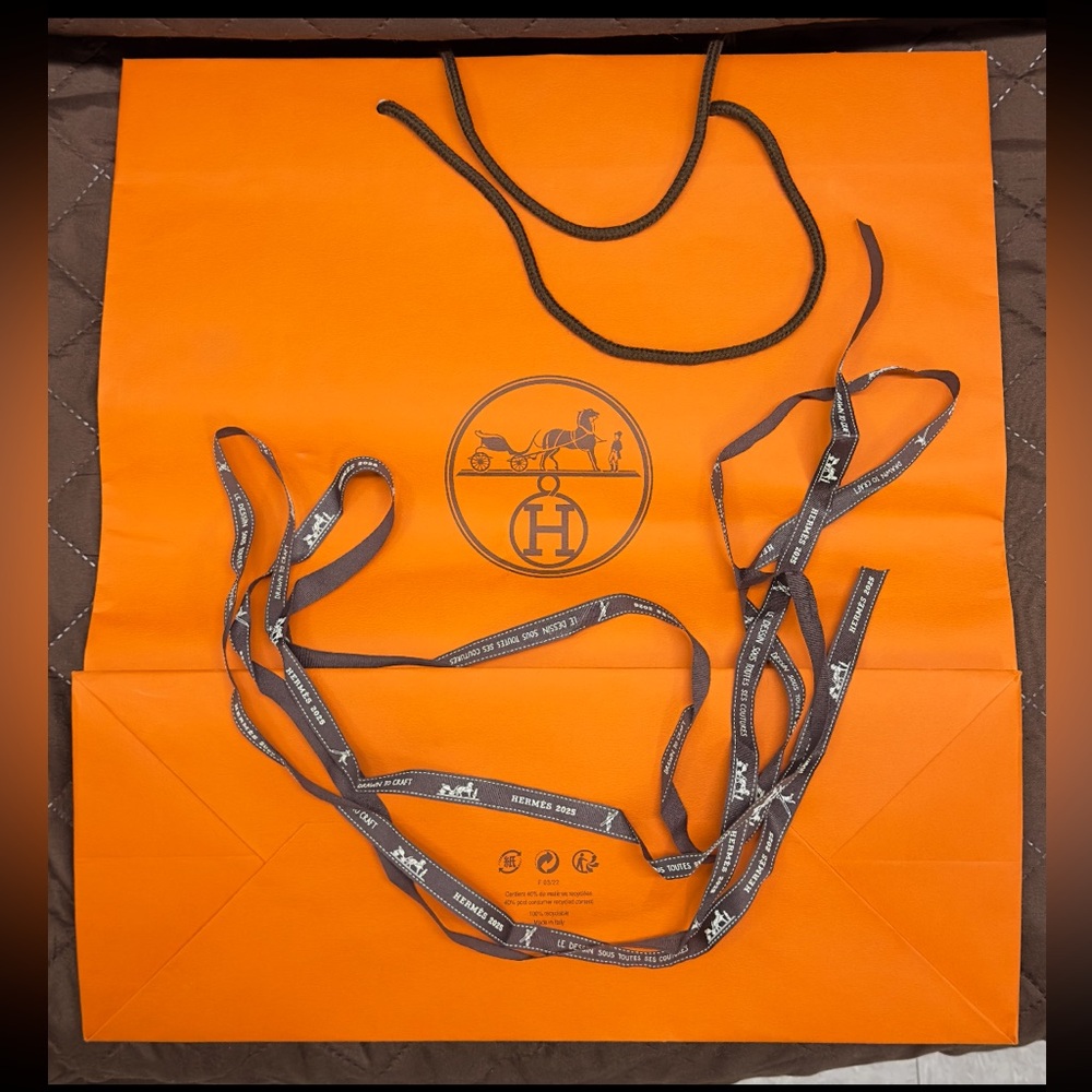 Hermès Vibrant Orange Bag with Black Ribbon